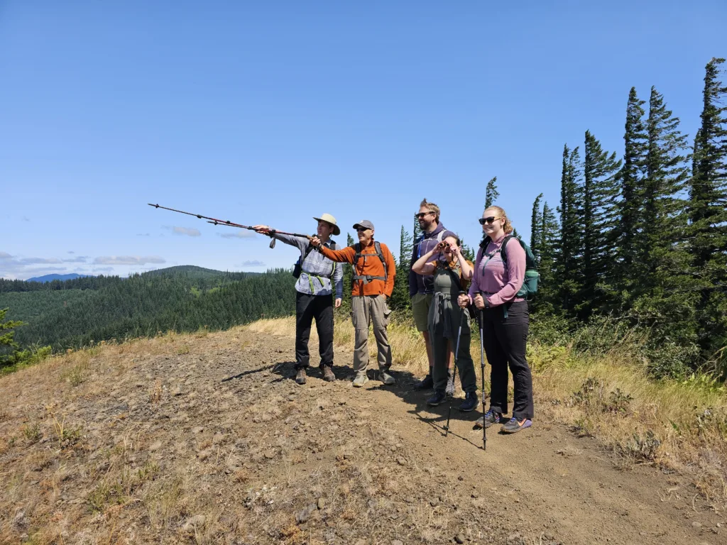 Friends staff celebrate the legal victories with a hike on the Whistling Ridge Trail. Left to right: Nathan Baker, Kevin Gorman, Noah Dow, Ella Devine, Madison Kenney. Photo by Rudy Salakory.