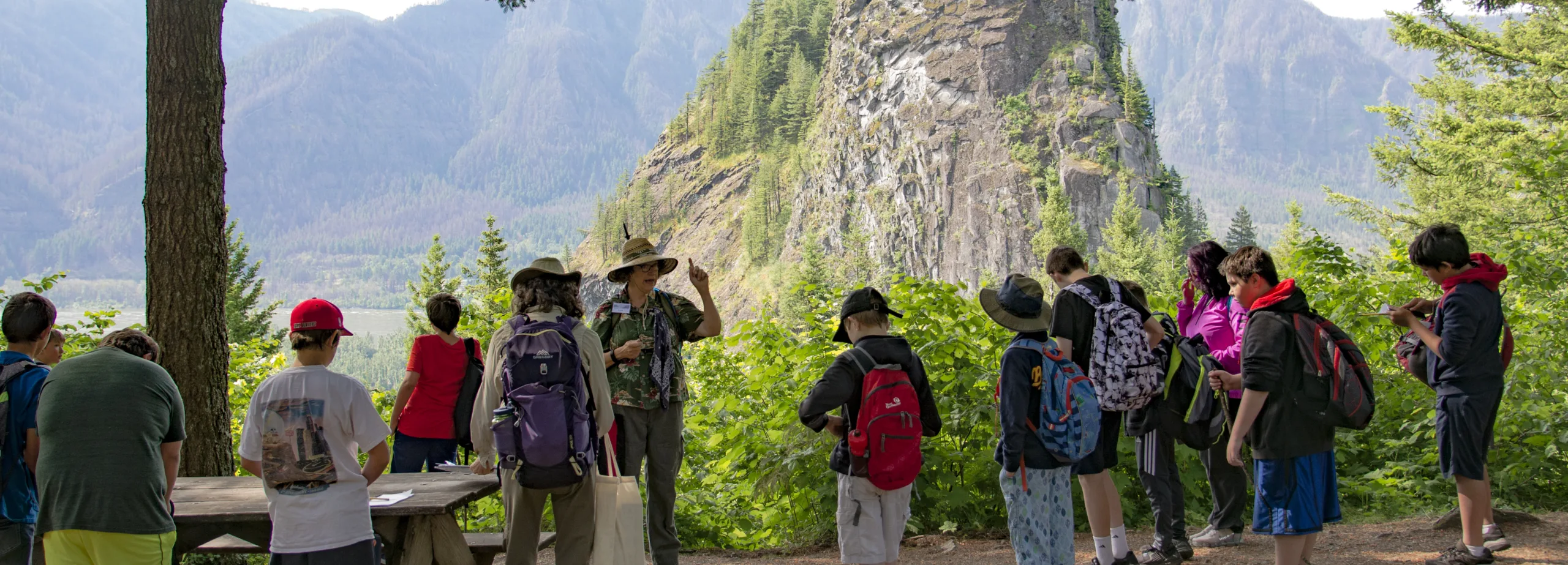 Students take a break on an educational hike at Hamilton Mountain during the 2018 Explore the Gorge trip. (photographer: Brandon Davis)