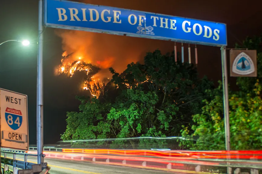 The Eagle Creek fire burns near Cascade Locks, Oregon, viewed from the north end of Bridge of the Gods in N. Bonneville, Wash., Sept. 4, 2017. (photographer: Tristan Fortsch)