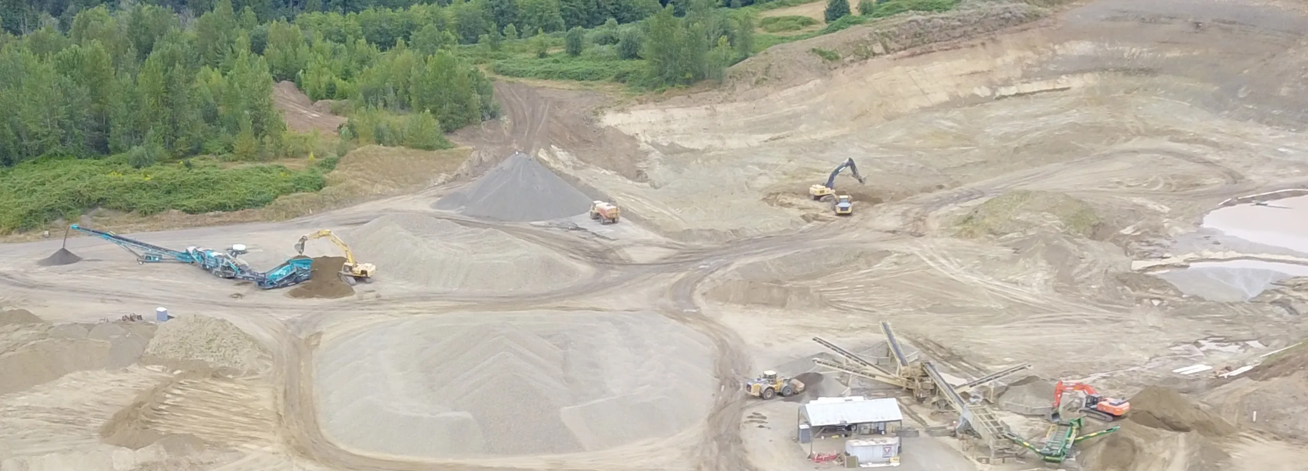 July 2019: Unpermitted rock crushing (at left) takes place at the Zimmerly gravel mine, within the Columbia River Gorge National Scenic Area.