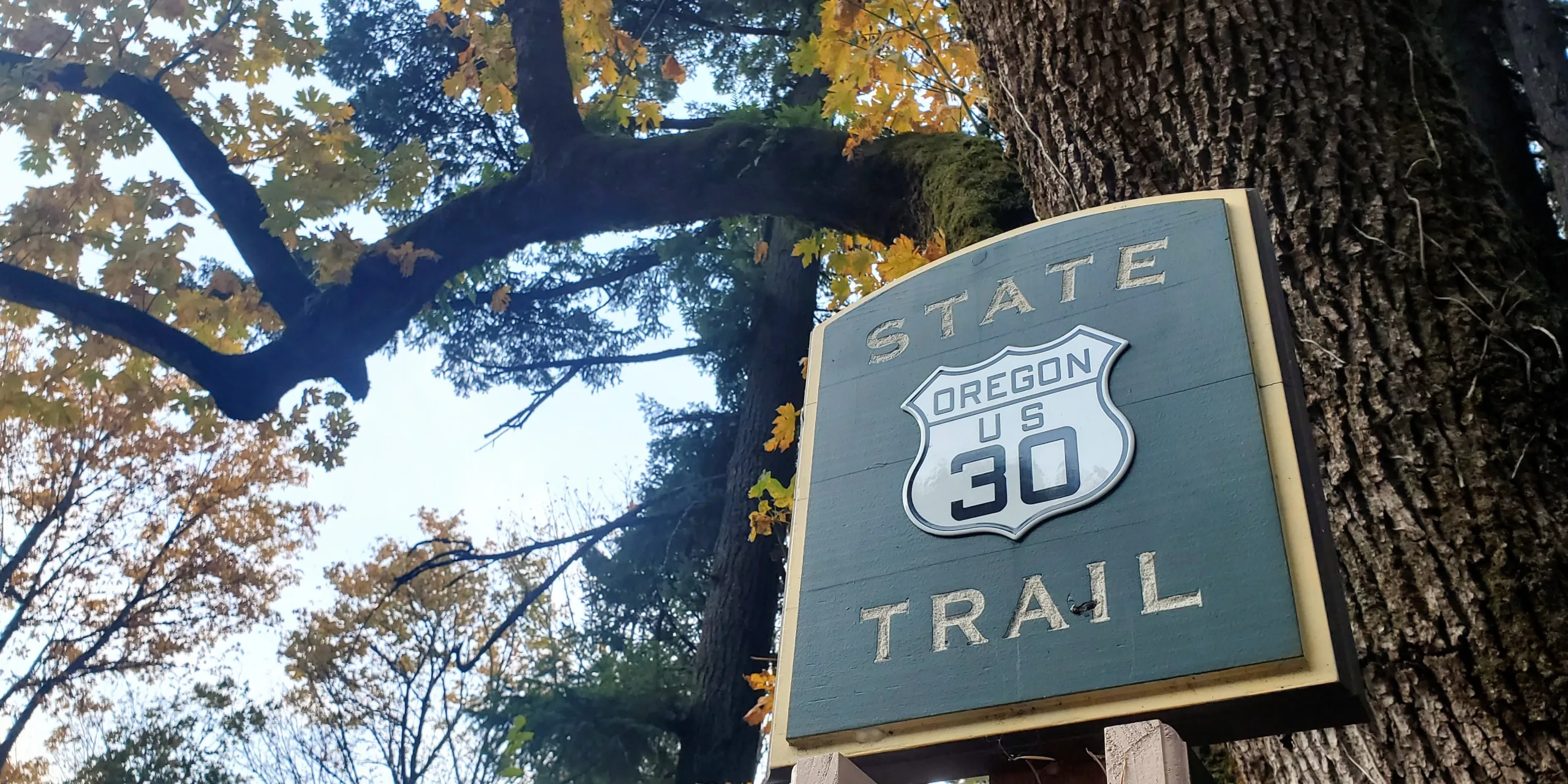 Marker sign near Cabin Creek Falls, along the Historic Columbia River Highway State Trail. Photo by Caitlin Muret.