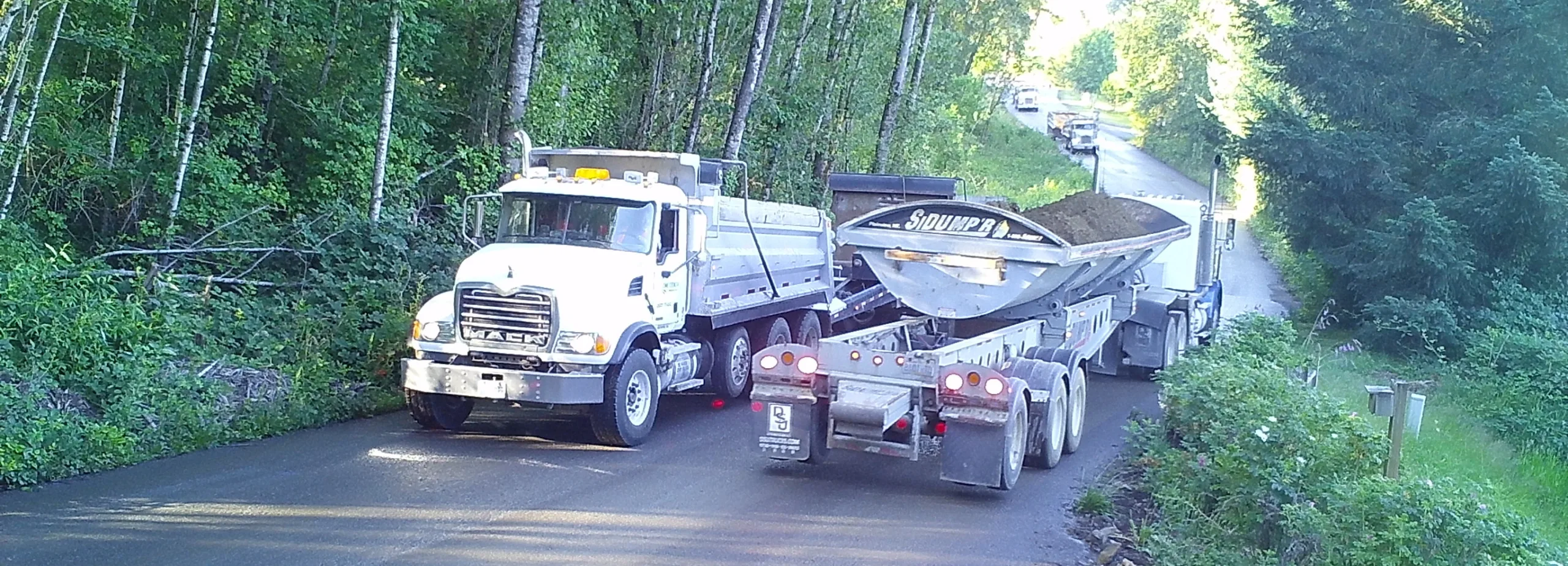 Mining trucks illegally haul gravel along Zimmerly's proposed mining haul route in June 2018. (Friends archive)