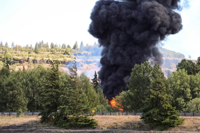 An oil train fire rages on near the bank of the Columbia River on Friday, June 3, 2016. (photographer: John Sepulvedo, Oregon Public Broadcasting)