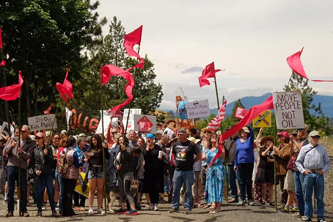After the derailment anniversary rally, attendees proceed to the Columbia River for a ceremony, June 3, 2017. (photographer: Kyle Ramey for Stand Up to Oil)