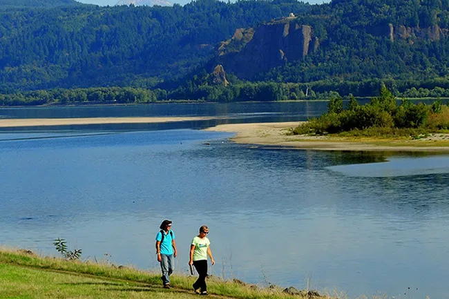 Walking along the Columbia River at the Steigerwald Shores property, with Crown Point and Vista House in the distance. (photographer: Debbie Asakawa)