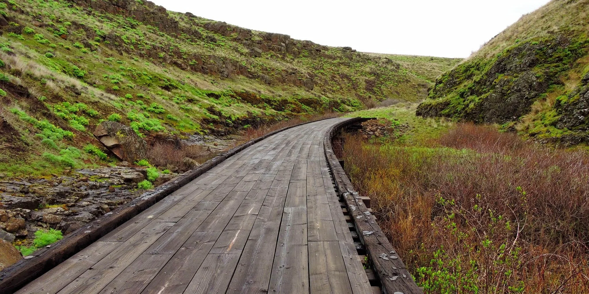 Crossing a former railroad trestle along the Klickitat Trail. Photo by Debbie Asakawa.