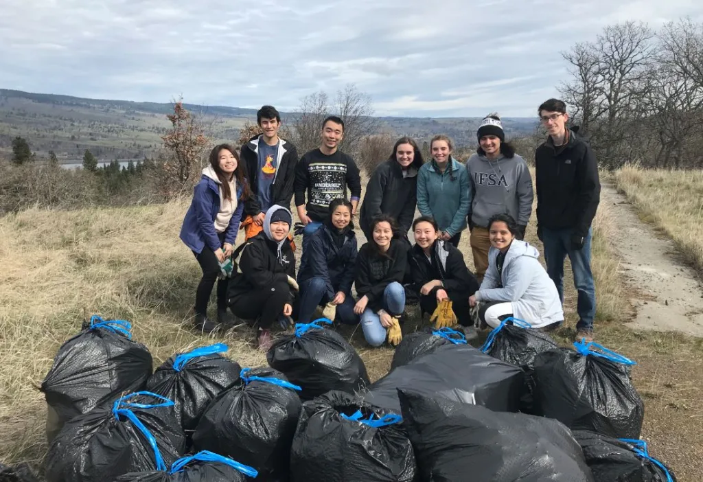 In March 2020, shortly before COVID-19 restrictions went into effect, college-student volunteersspent a day pulling weeds at Friends' Mosier Plateau land trust preserve. (photographer: Frances Fischer)