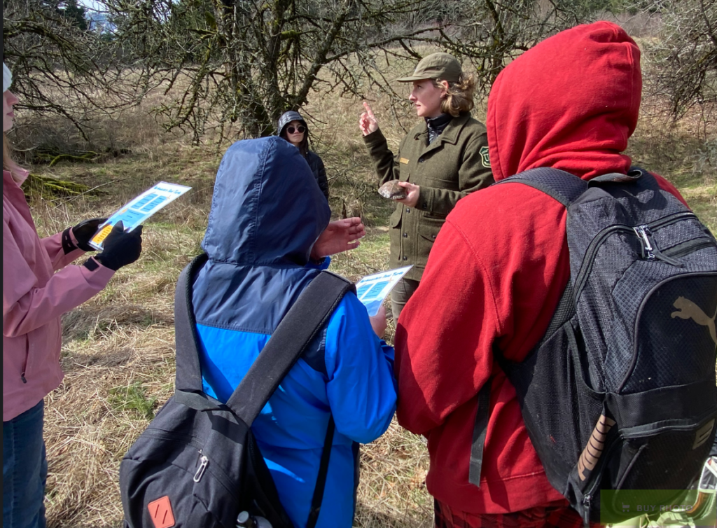 Middle school students receive a herpetology lesson from a U.S. Forest Service Ranger. (photographer: Frances Fischer)