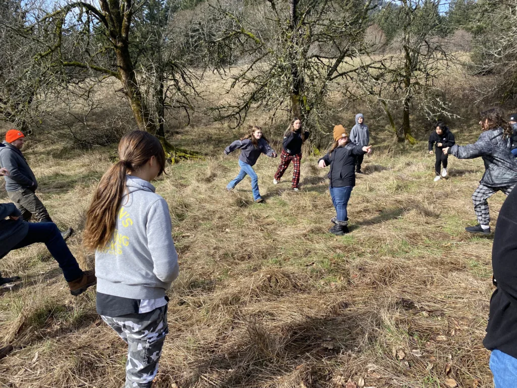 Students take part in "predator vs. prey" role play game. (photographer: Frances Fischer)