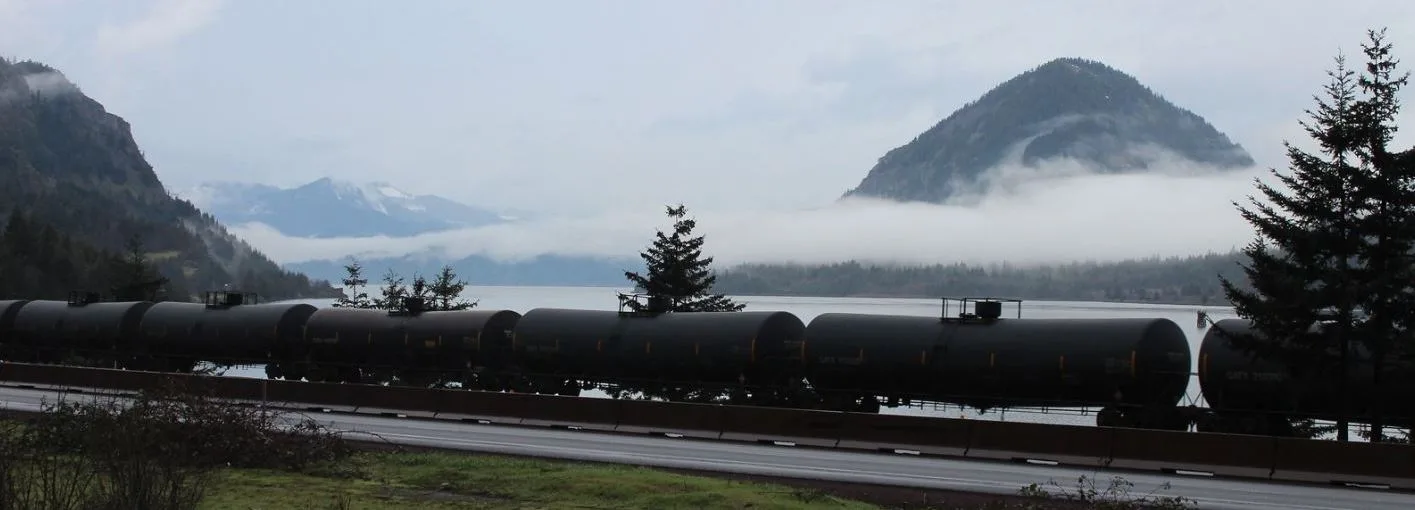 Union Pacific unit oil train travels along I-84 by Starvation Creek State Park. (photographer: Stan Hall)