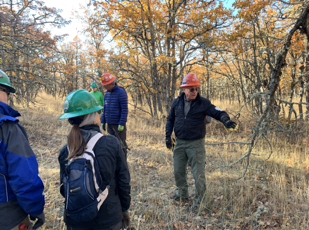 Washington Trails Association volunteers get a briefing on the job at Lyle Cherry Orchard. (photographer: Brandon Tigner)